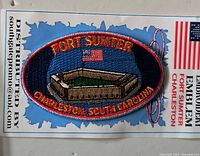 Front of patch on card with clear view of design and text