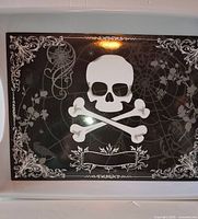 Top view of tray shows full skull and crossbones design