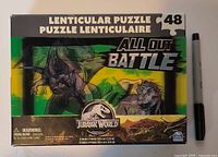 Front of puzzle box next to marker for scale