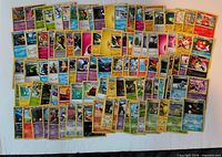 All 100 Pokémon cards laid out showing mix of types