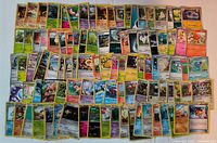 Overview of all 100 Pokémon cards spread out