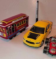 Cable car, yellow Charger, red race car grouped