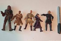 All five Star Wars action figures with Sharpie for scale