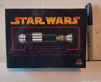 Front of boxed Star Wars Obi-Wan Kenobi lightsaber scaled replica