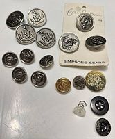 Group of all buttons including Simpsons-Sears card