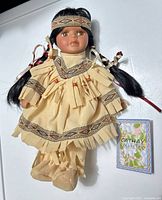 Full view of Cathay Collection doll with certificate/tag