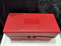 closed red plastic storage case top view
