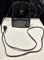 Front view of Electrohome projection alarm clock radio with attached AC cord visible