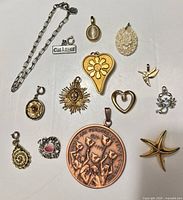 All thirteen jewelry pieces laid flat for overview