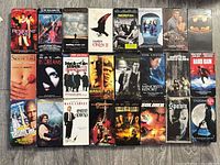 All 24 VHS tapes laid out in four rows