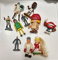 All ten assorted figures arranged on tray
