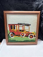 Front view of framed needlepoint showing entire artwork