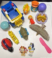 Overhead view of full toy lot on white surface
