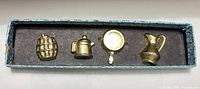 Full boxed set of four brass kitchen novelty magnets
