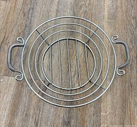 Top view of stainless steel circular wire basket with handles