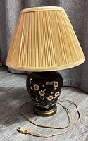 Full lamp with shade, cord visible