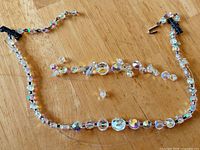 Entire necklace laid out with loose beads shown