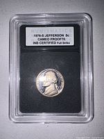 Slabbed 1976-S Jefferson nickel with INB label visible