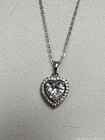 Front view of silver-tone chain with heart halo pendant