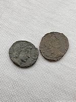 Two ancient Roman coins side by side showing obverse portraits