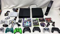 All consoles, controllers, games and accessories laid out