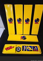 Outer yellow Dick Tracy logo boxes and open display tray showing wristwatch set