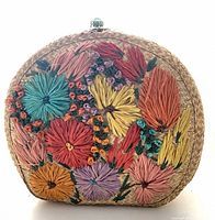 Front of raffia-embroidered straw bag