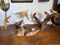 All four carvings on tabletop