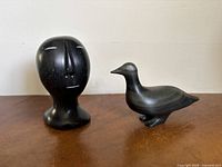 both soapstone carvings side by side