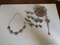 Assortment laid out showing all seven jewelry pieces