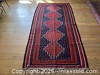 Full view of the kilim rug laid flat on the floor