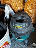 Shop-Vac 5-gallon vacuum canister showing brand label and lid