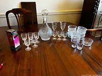 Group shot of all glass items and boxed jigger on table