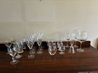 Assorted glassware arranged on wooden surface