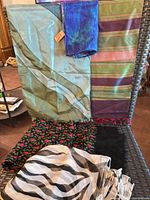 Group of six scarves displayed on chair