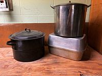 Black enamel canner, stainless stock pot, aluminum roasting pan set