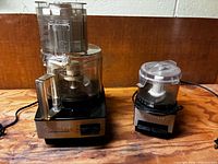 Both Cuisinart appliances side by side showing size difference and power cords