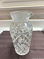 Full view of cut crystal pitcher showing diamond lattice pattern and frosted spout