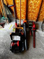 Group view of all Black & Decker tools standing and lying in garage