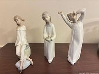 All three Lladro figurines front view on tabletop