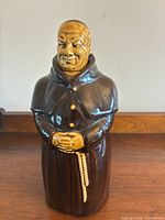 full view of ceramic monk decanter