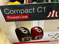 Retail box showing Compact C1 PowerLine branding and product images