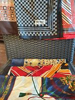 Four silk scarves displayed, Pier Olivier label visible