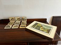 Stack of placemats alongside nine coasters on dark wood surface