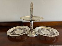 Candy dish fully opened showing three pierced trays