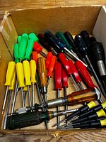 Box containing 40 screwdrivers of various colors and sizes