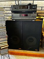 Sony receiver, Technics CD player stacked atop Accusound speakers