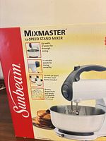 Retail box showing Sunbeam Mixmaster 12-Speed Stand Mixer and features