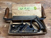 Plane and drawknife together in box