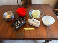 Full lot view on table showing mixer, pouch, attachments and all bowls